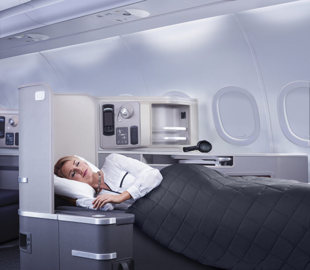 business class sleeping in a seat